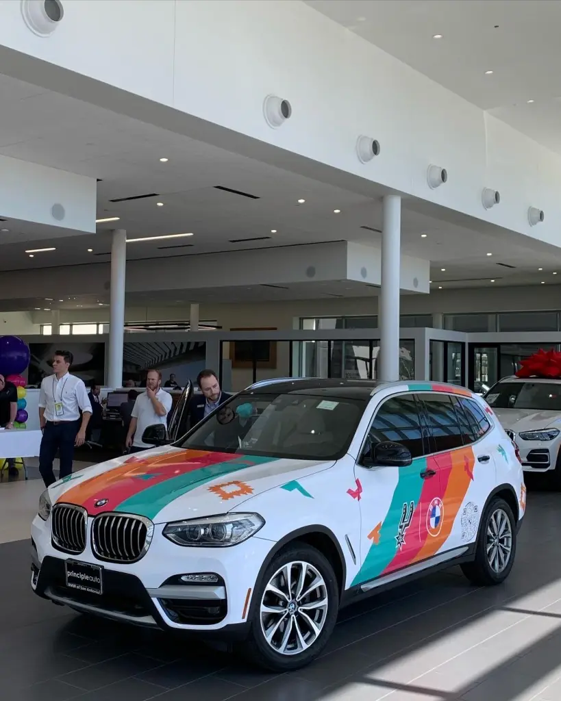 Custom wrap collaboration between the San Antonio Spurs and BMW San Antonio on display at Texas Custom Wraps