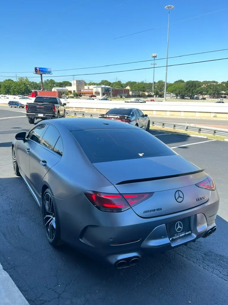 Mercedes CLS coupe with a Texas Custom Wraps dealer plate frame