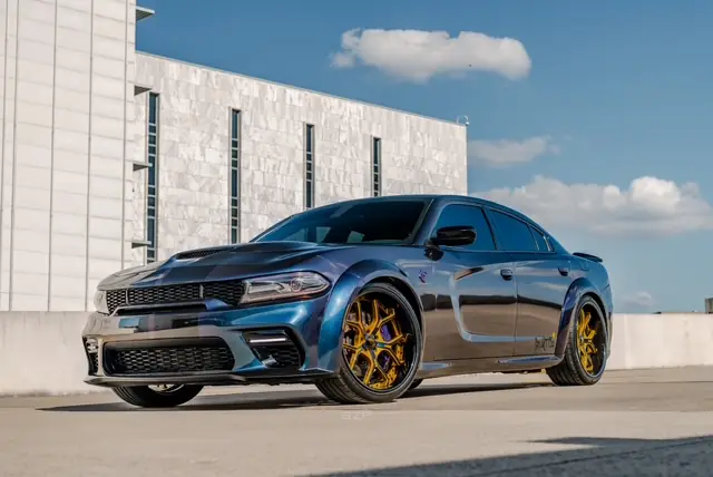 Colour shifting Hellcat with a wide body kit finished at Texas Custom Wraps