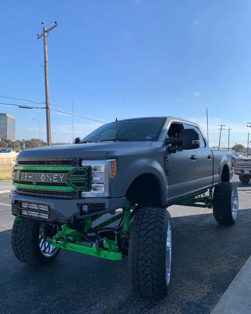 Lifted Ford F250 in a matte light grey colour change